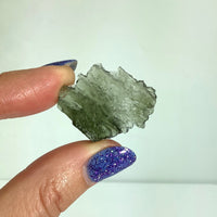 Thumbnail for Person holding Moldavite raw glitter, 1.1’ Besednice rough from Czech Republic