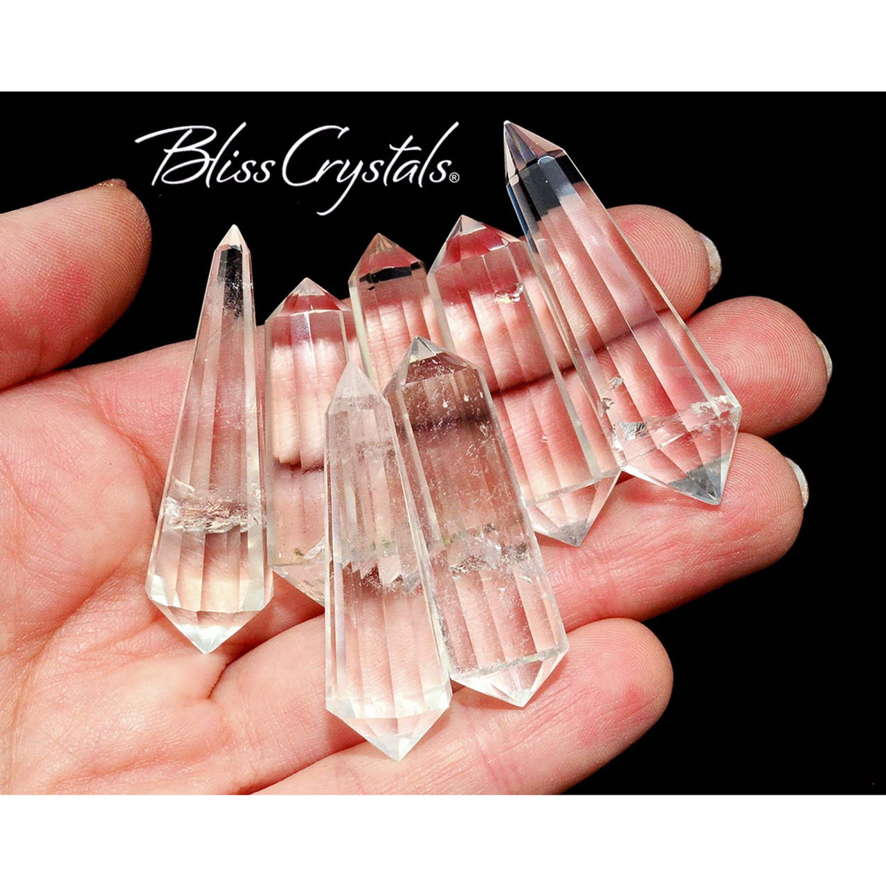 Hand holding clear quartz double terminated points from #CV13 Healing Crystal and Stone