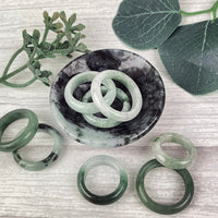 Thumbnail for A couple of jade polished rings sitting on top of a table, perfect for any occasion