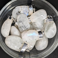 Thumbnail for A bowl filled with white crystals for 1 Rainbow Moonstone AAA Tumbled Pendant SK6874