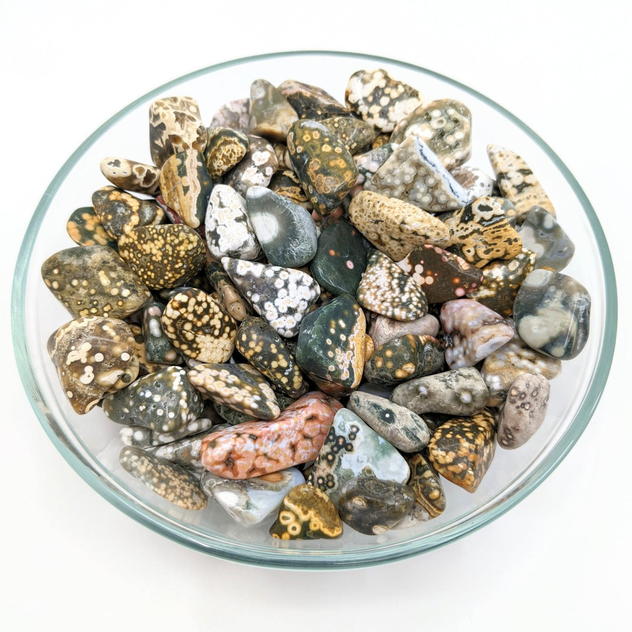 A bowl of mixed-size ocean jasper tumbled stones, product #LV1275