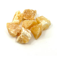 Thumbnail for Sliced peeled oranges on white surface, featured with 2 Orange Calcite Rough Chunks (54g) #LV1143