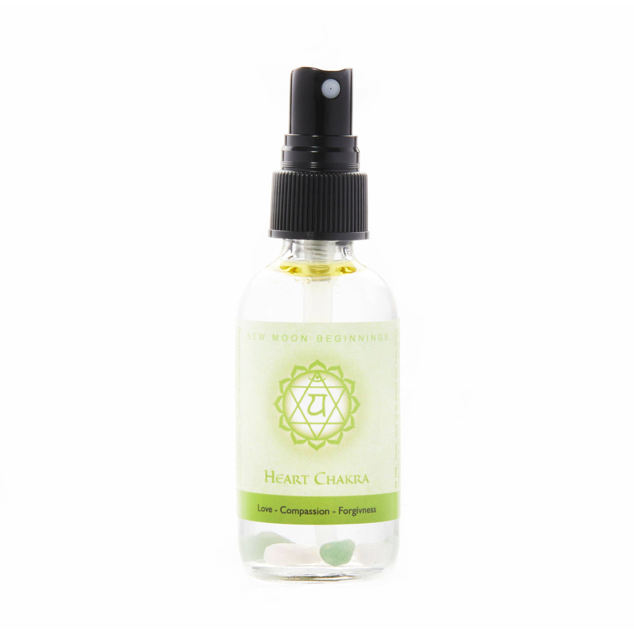 7 Chakra Balancing Spray with green chakra oil, essential oils, and crystals for holistic use