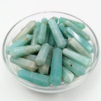 Thumbnail for A bowl of green and white quartz chips with Amazonite Mini DT Point Wand in display