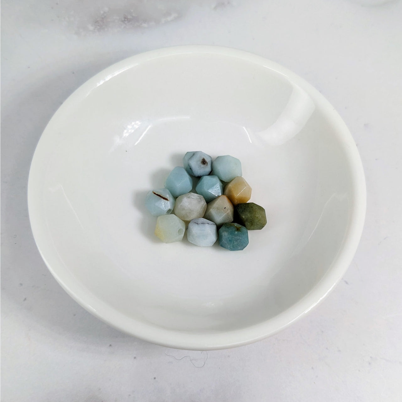 White bowl with blue and green Amazonite Faceted 7 mm Bead pack #LV3613 marbles