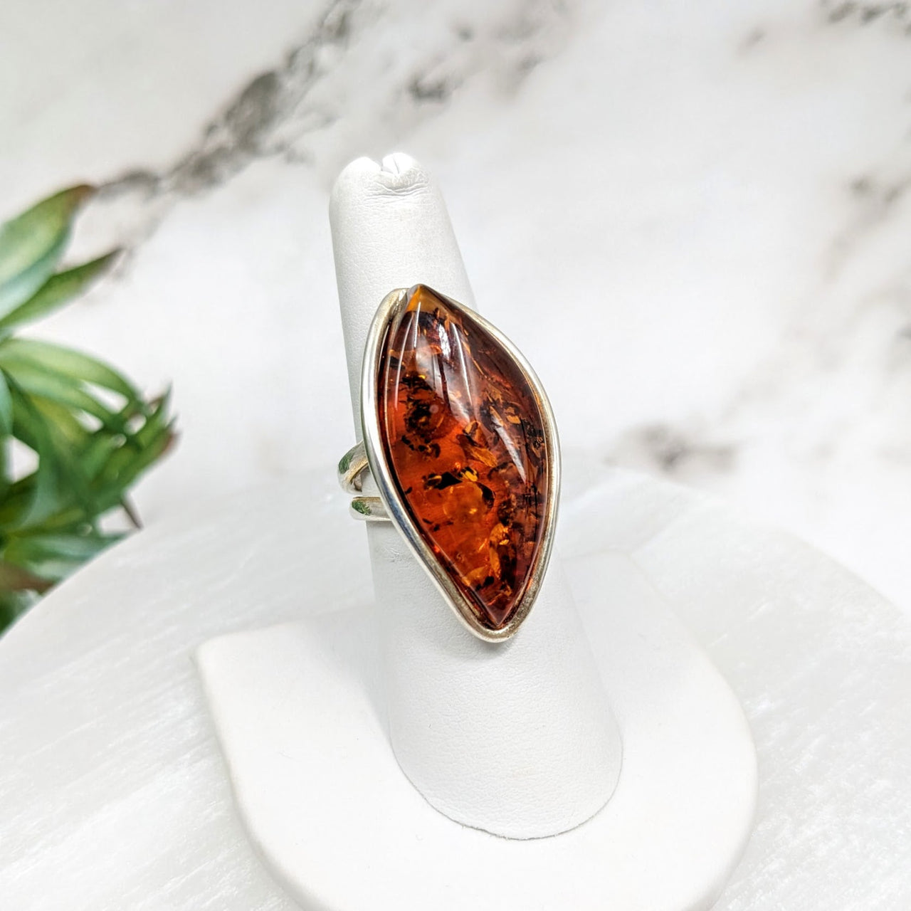 Amber Adj. 7-9 Ring #LV4466 with a striking large orange stone in the center