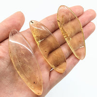 Thumbnail for Two large oval gold glass beads, Amber Copal w/ insect inclusions, polished, product #LV1870