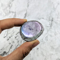 Thumbnail for Hand holding a large purple Amethyst Rainbow Aura Quartz palm stone #LV2018