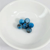 Thumbnail for A white bowl filled with blue Apatite 7 mm Round Beads from the 6 pack #LV3628 product