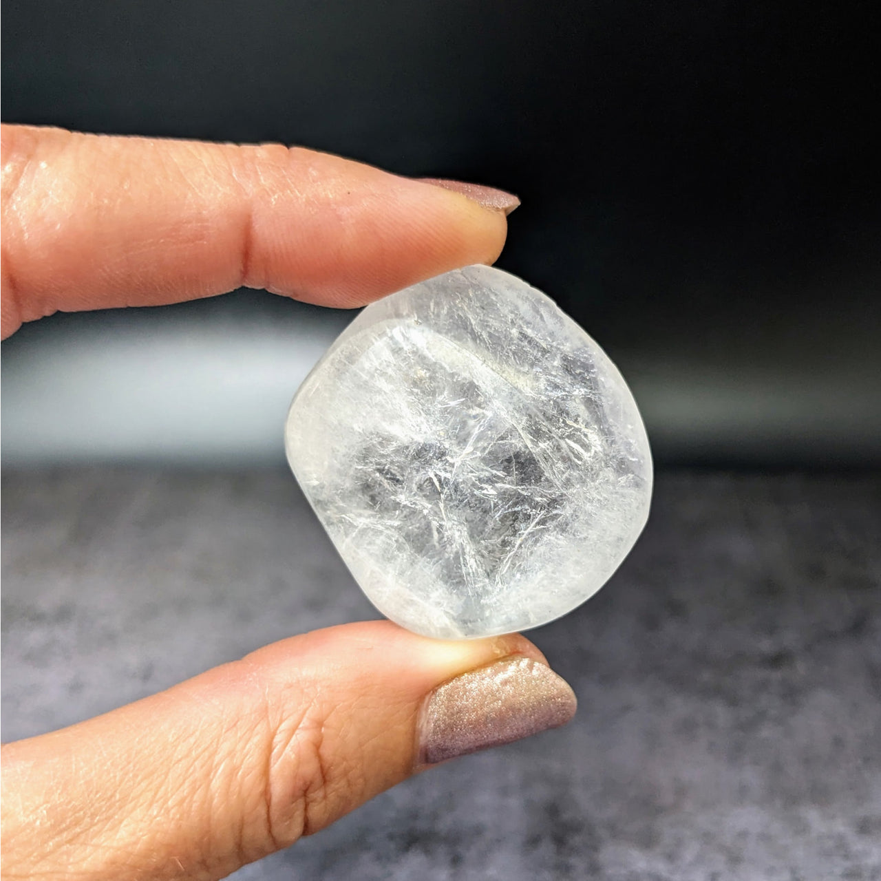 Person holding large white Apophyllite tumbled stone Gem A+ #LV3892