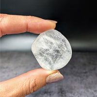 Thumbnail for Person holding large white Apophyllite tumbled stone Gem A+ #LV3892