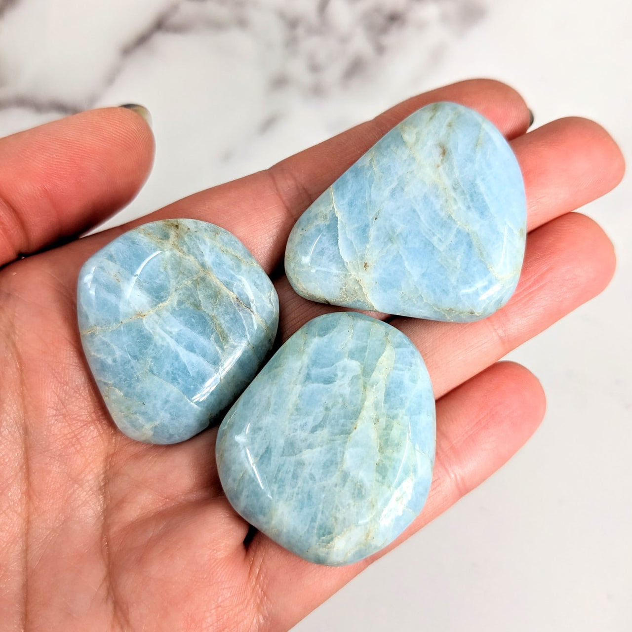 Three blue amazonite palm stones for sale in product Aquamarine Palmstone #LV2125