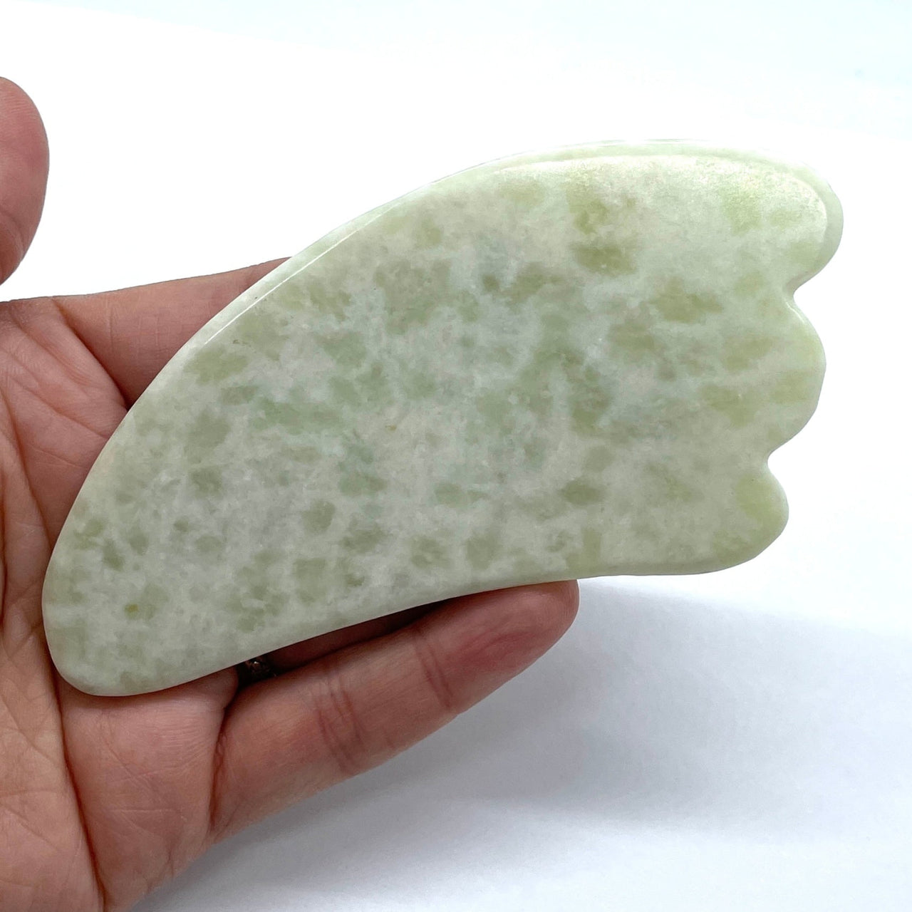 A person holding a green jade stone, Assorted Crystal Gua Sha Massage Tool #K166