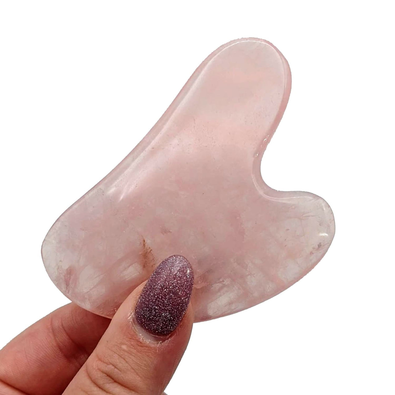 A person holding a pink quartz stone from Assorted Crystal Gua Sha Massage Tool #K166