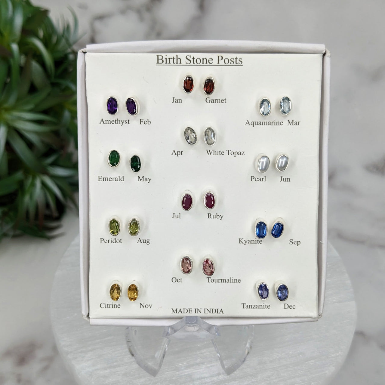 Close-up of Birthstone Gem Sterling Silver Stud Earrings showcasing diverse colored gems