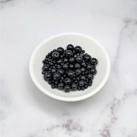 Thumbnail for A bowl of blueberries on a marble counter showcasing Black Onyx Assorted Size Bead Pack #LV3652