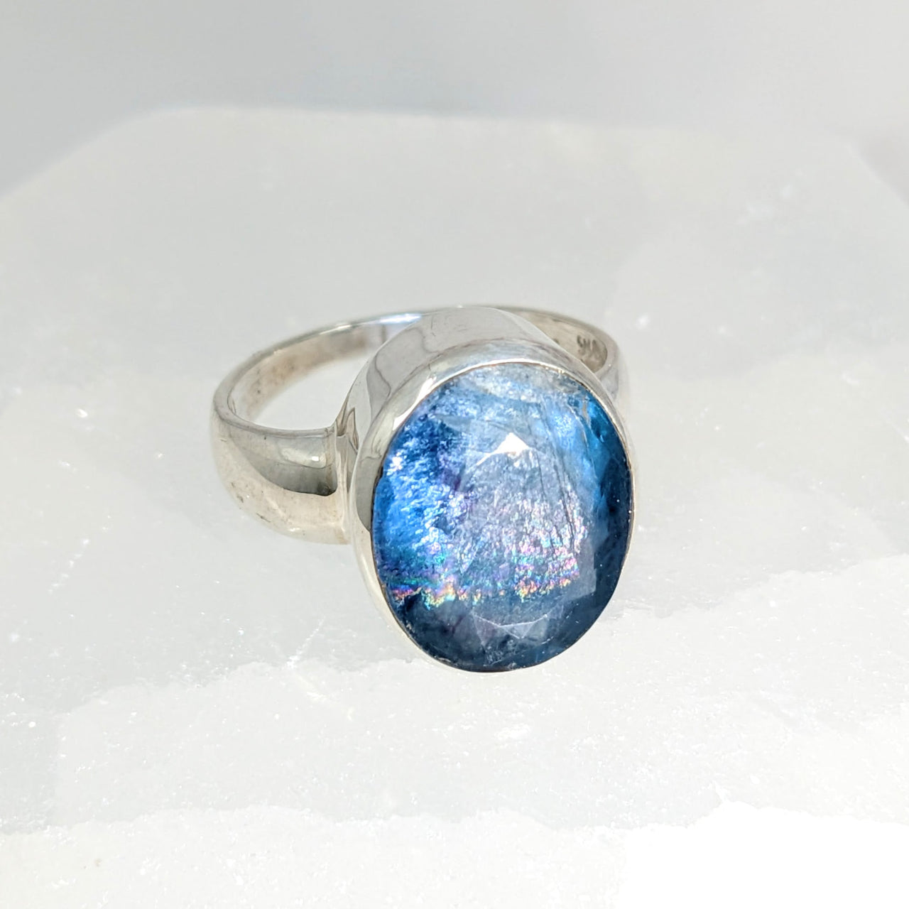 Blue Fluorite Faceted Sz 6.5 Oval Ring #LV1569 with a blue stone on a white background