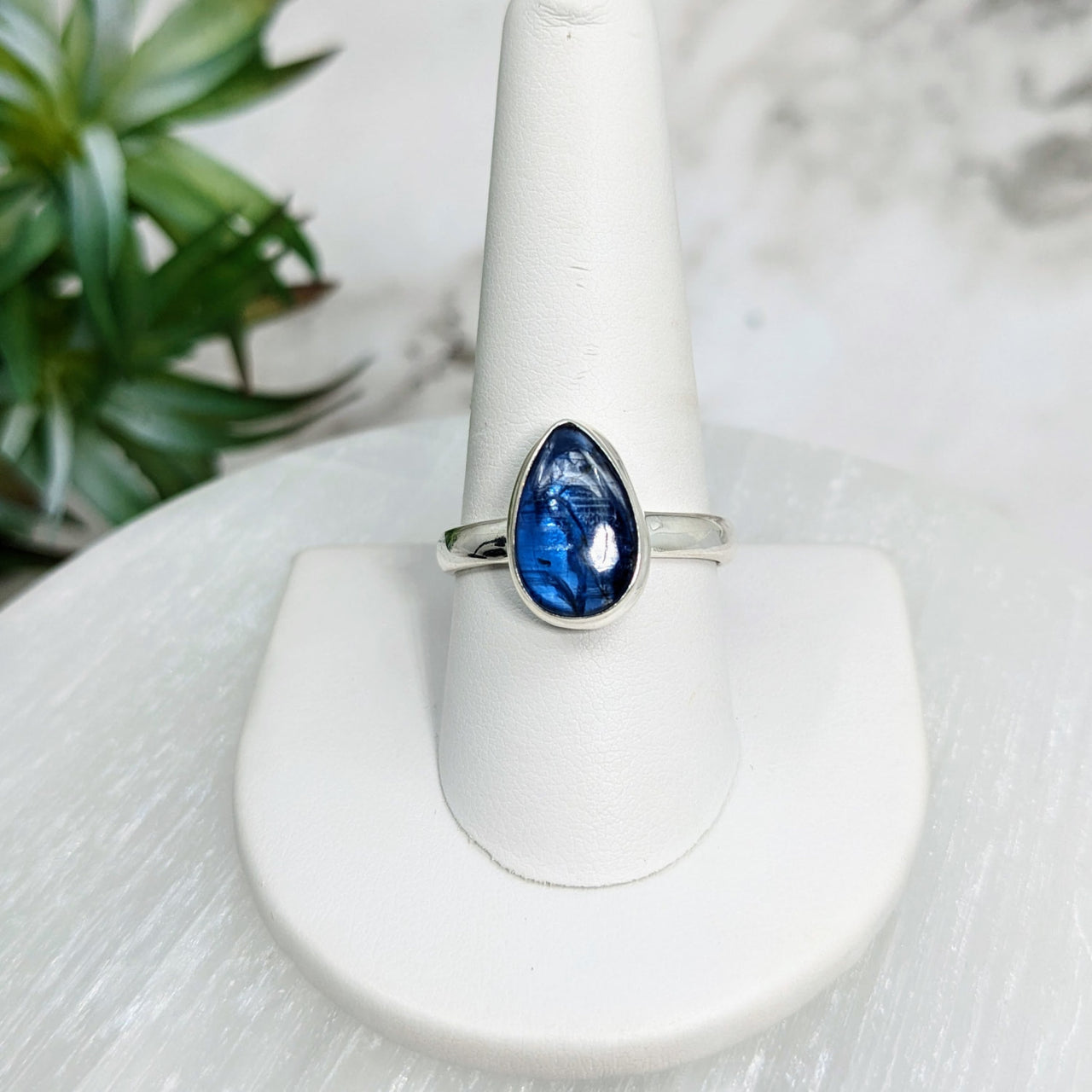 Blue Kyanite Sz. 10 S.S. Teardrop Ring #LV5024 displayed on a white ring stand