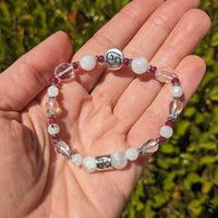 Thumbnail for Hand holding Cancer Zodiac Handmade Beaded Bracelet with white and red beads