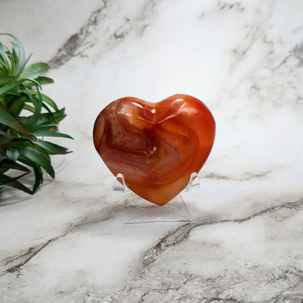 Carnelian heart-shaped rock on marble table - 2.3’ Heart #LV4479