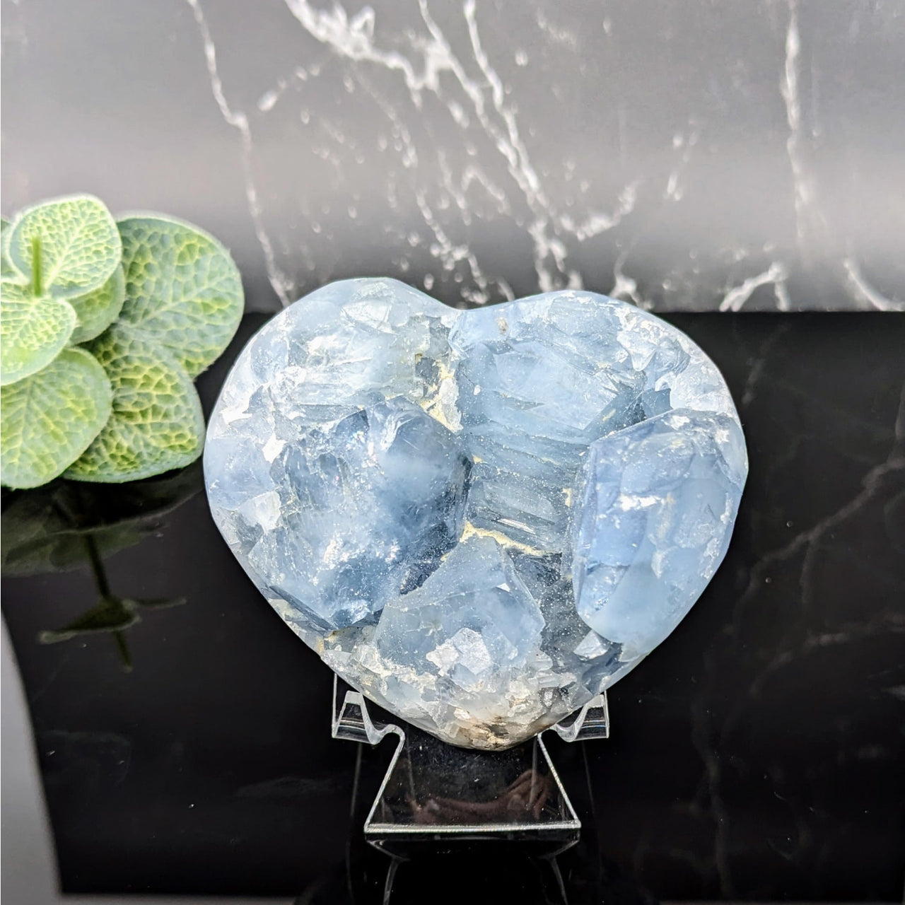 Blue Quartz Heart from Celestite Geode Collection on Black Table (Model LV5713)