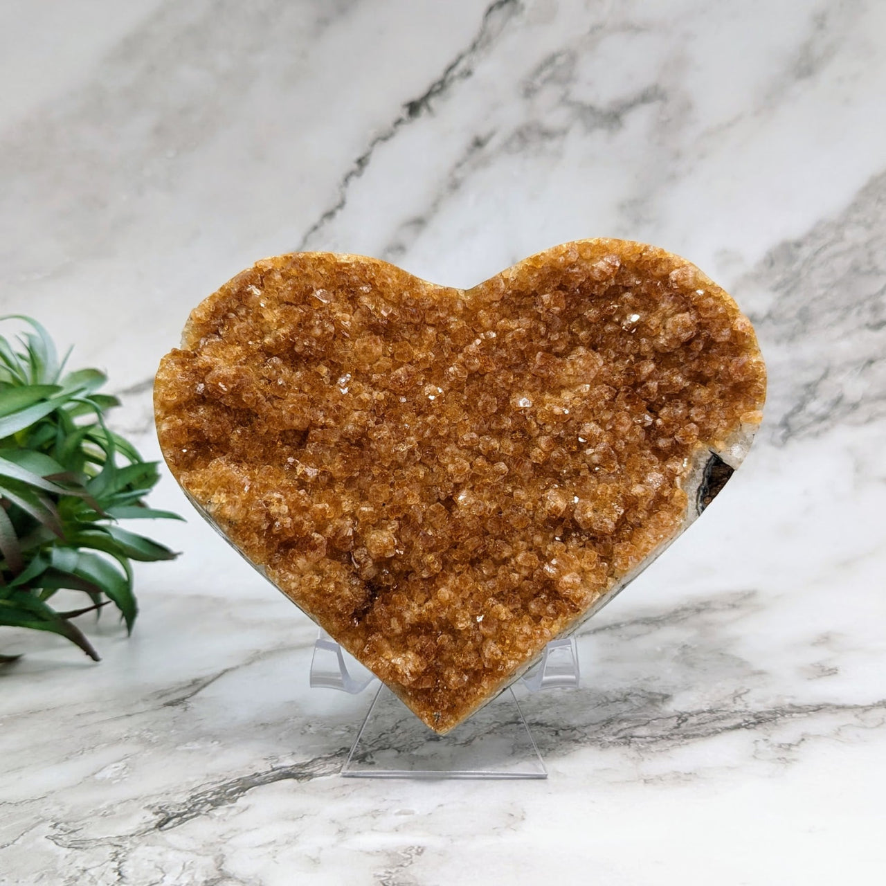 Heart-shaped cookie on marble counter next to Citrine Geode 4.7’ Heart #LV4405