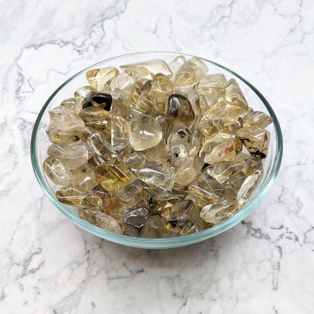 A bowl of yellow quartz in a ’Citrine Natural Tumble Stones’ product from Bliss Crystals