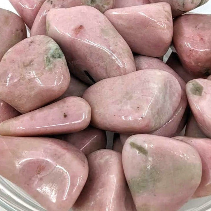 A bowl filled with pink Clinozoisite tumbled stones, product code SK7404