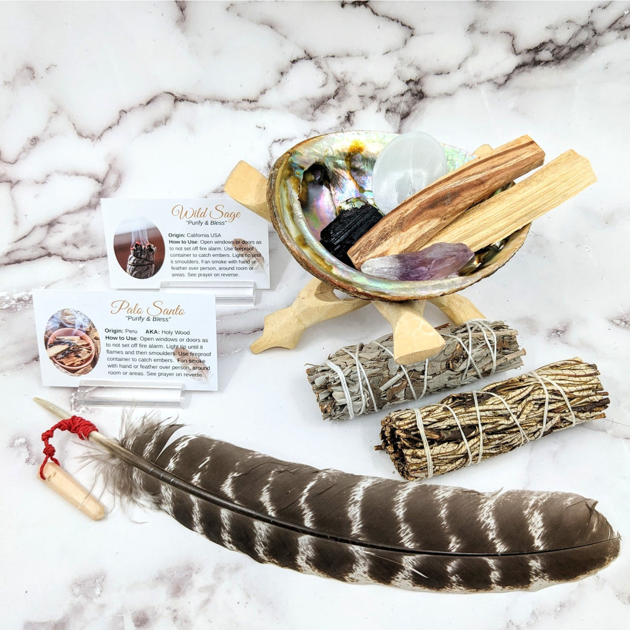 Feather, bowl, and prayer card in the Deluxe Master Cleansing Set #SK9566 with Palo Santo