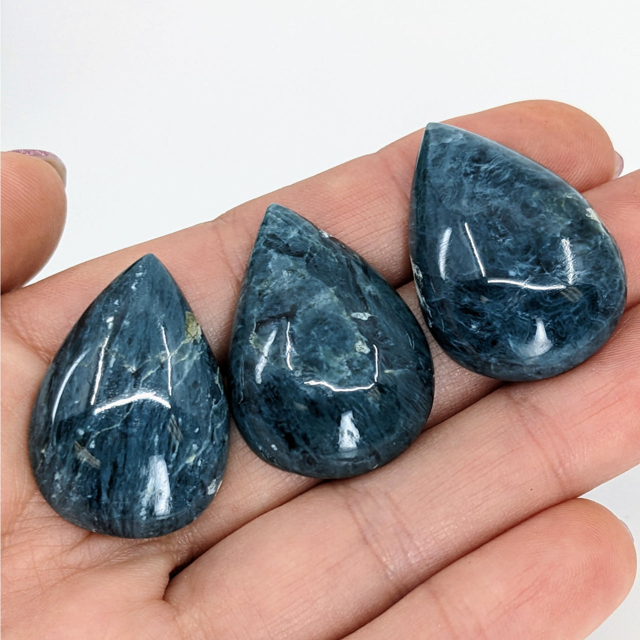 Dianite Blue Jade Cabochon #LV3368 – 1.2” stones held in hand