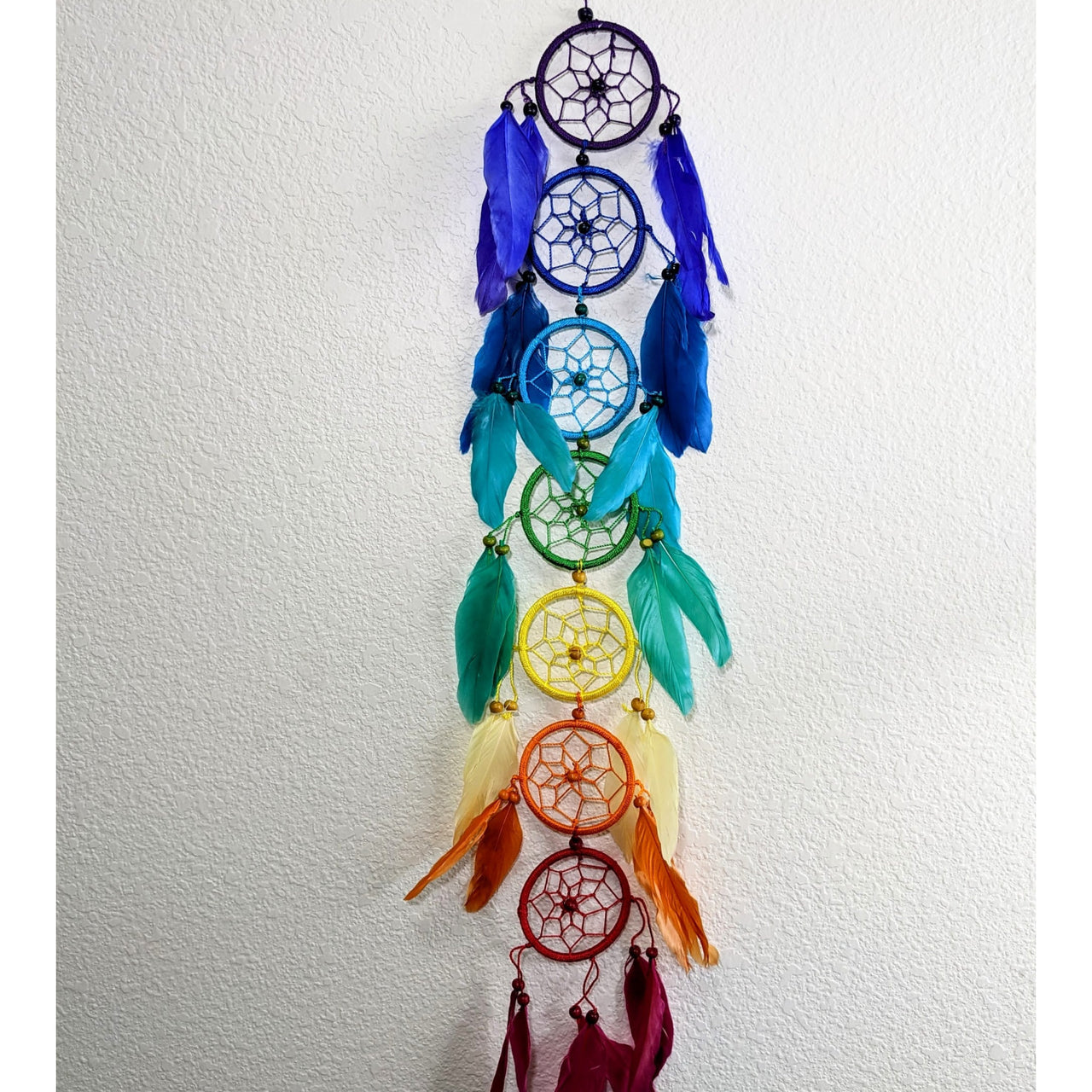 Dreamcatcher for 7 Chakras w/ Feathers #SK9575 hanging on a wall