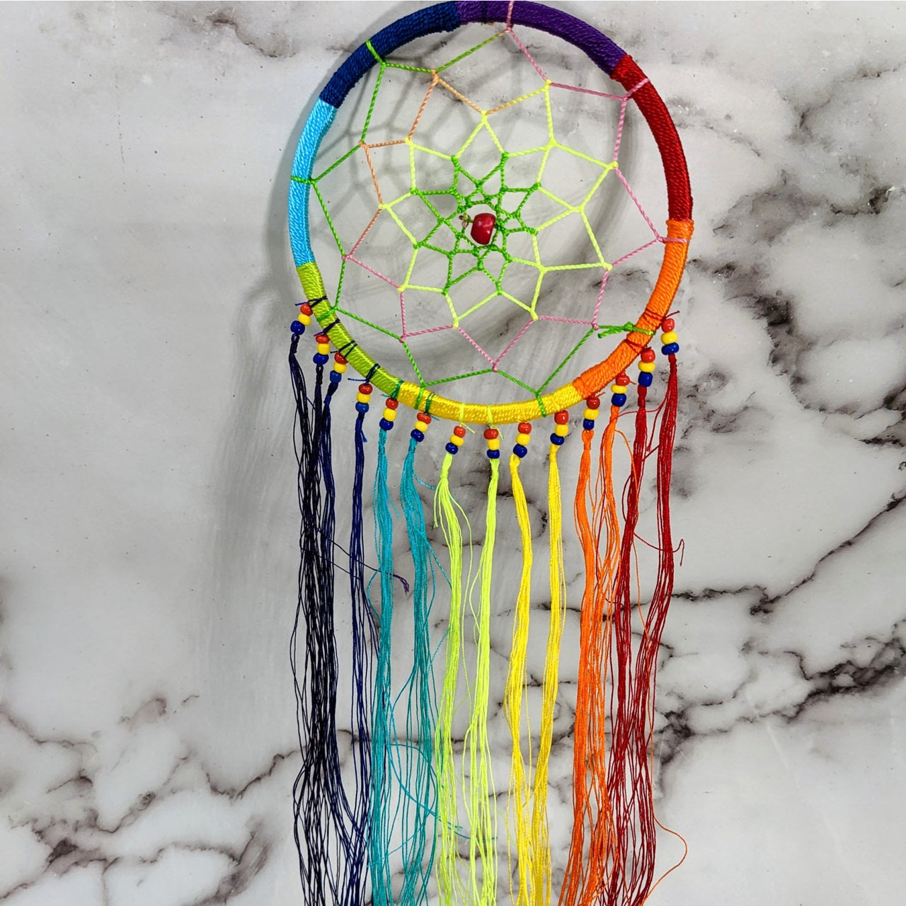 Rainbow Colored Dreamcatcher with Long Tassels on Marble Background #SK9574