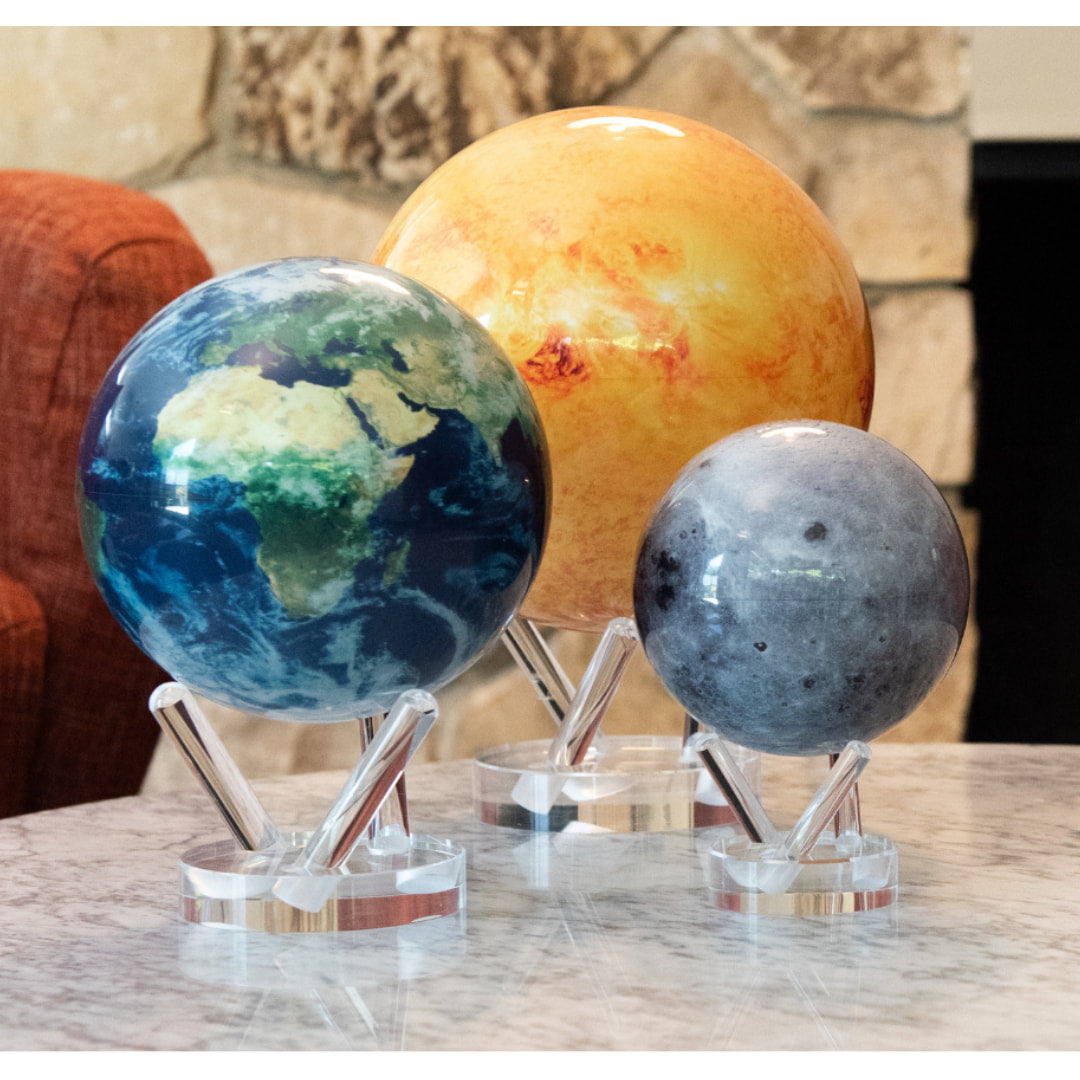 Three planets on marble table: Earth Relief Mova Globe 6’ w/ acrylic base #MG6RBE