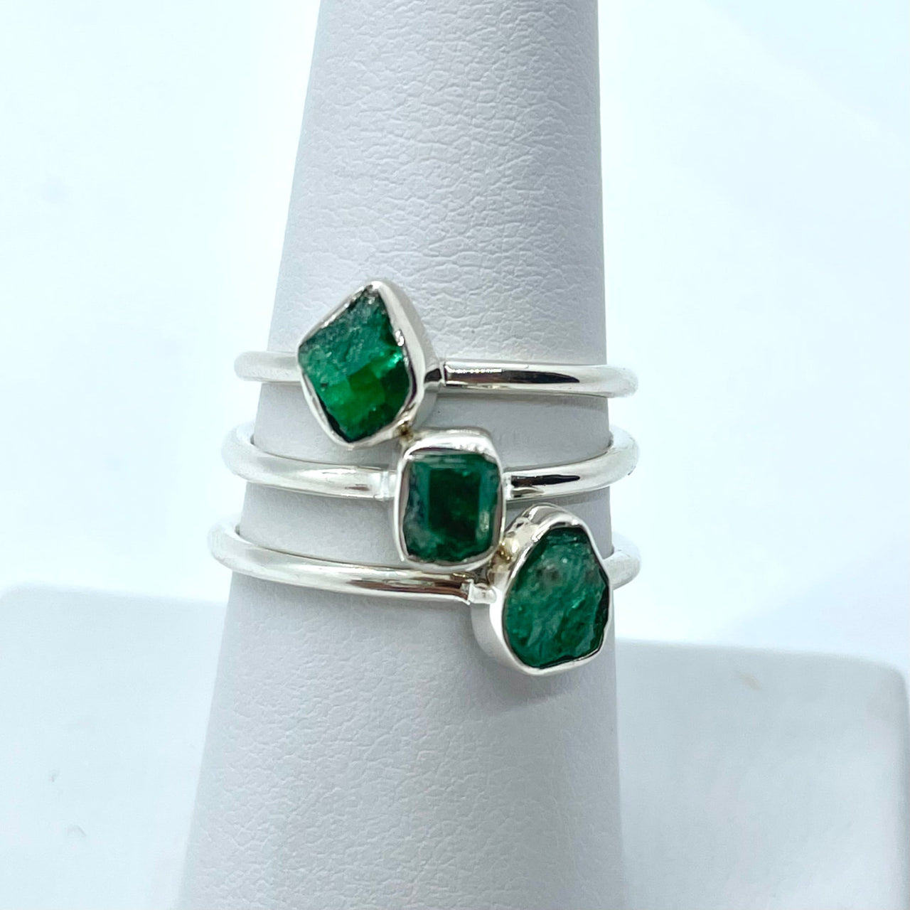 Emerald Rough Sterling Silver Dainty Ring #J625 with a green emerald stone on a white band