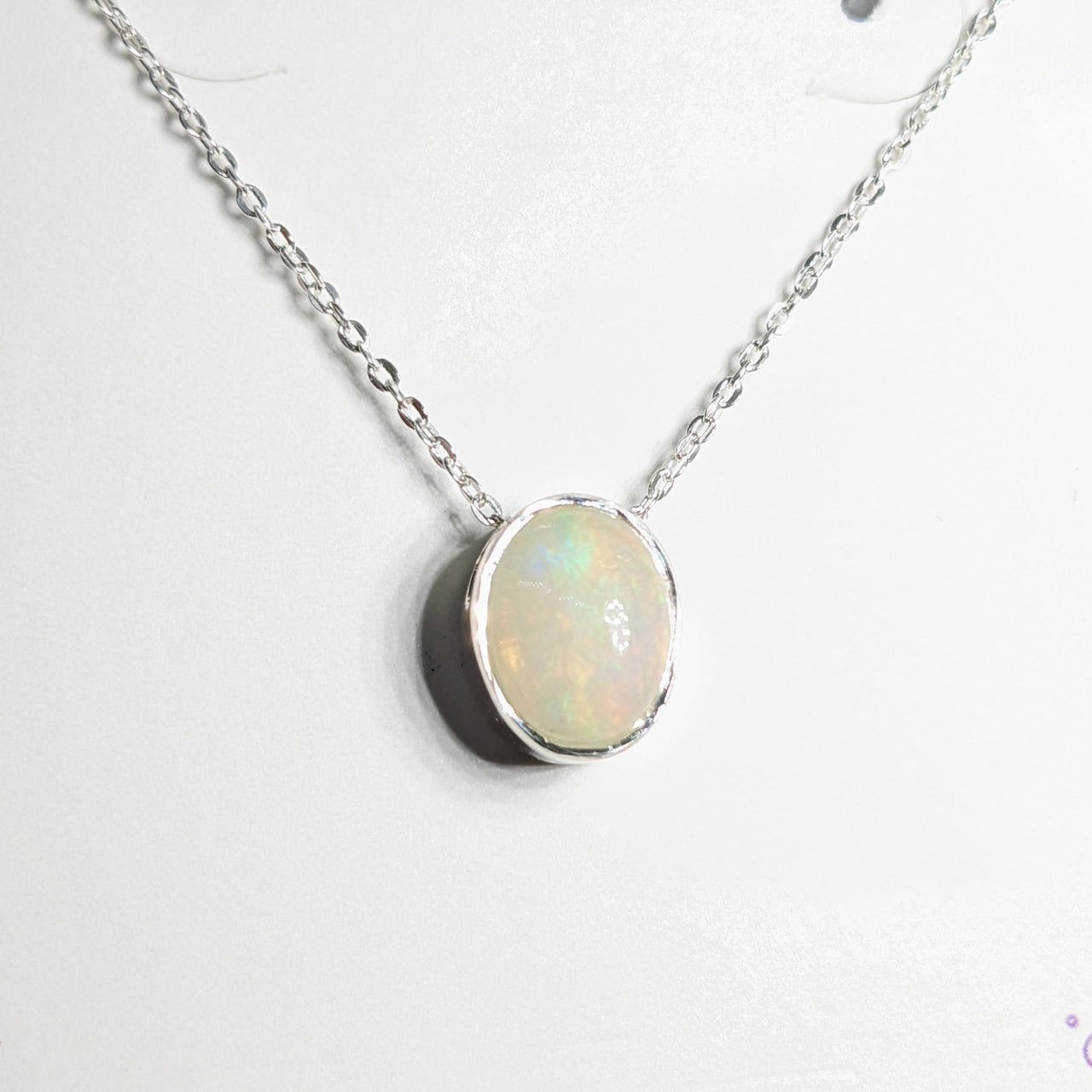 Close-up of Ethiopian Opal Sterling Silver Slider Pendant on Adjustable Chain Necklace