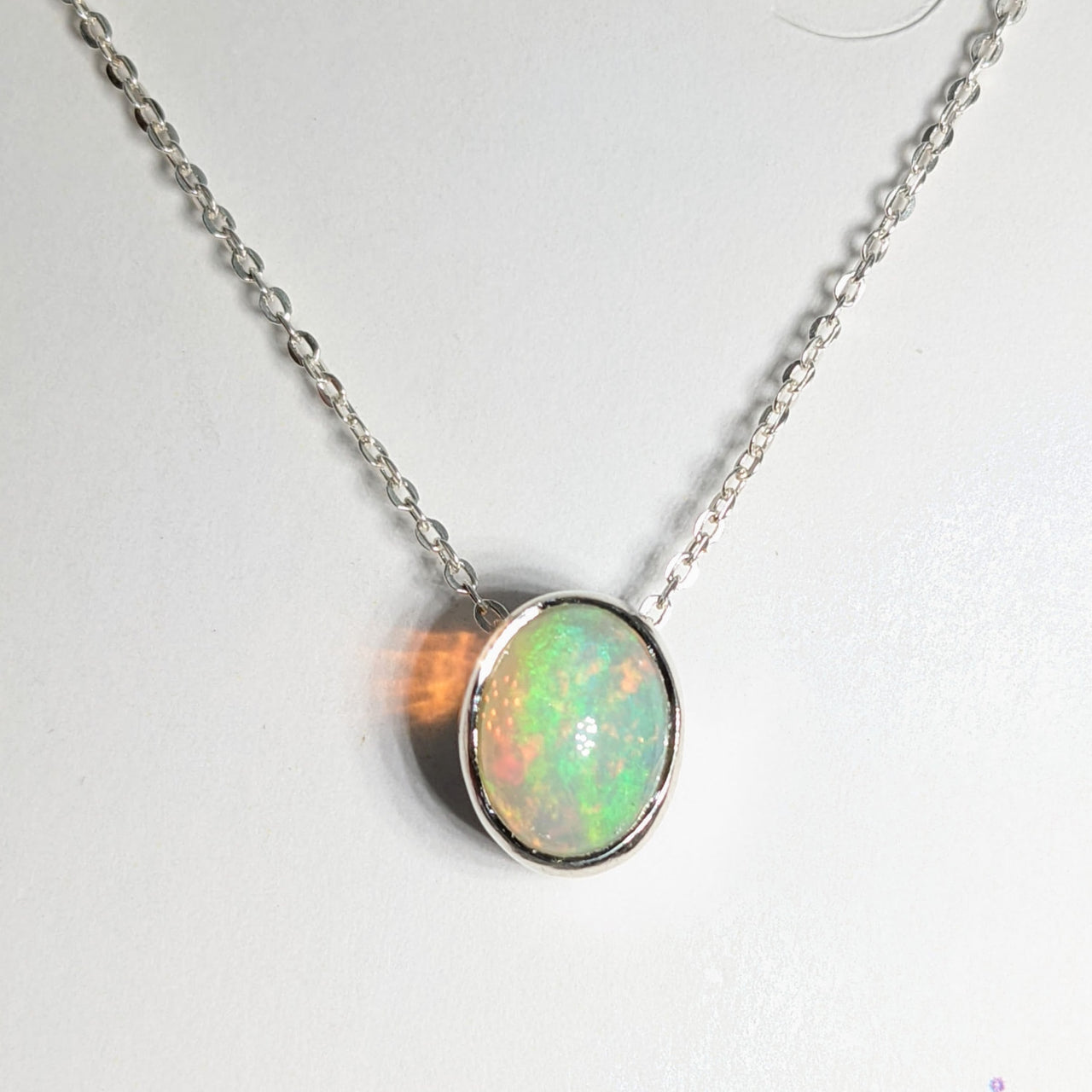 Close-up of Ethiopian Opal Sterling Silver Slider Pendant on an Adjustable Chain Necklace