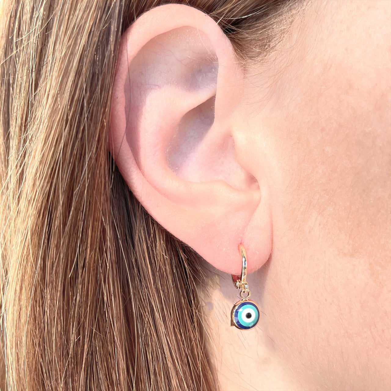 Woman wearing Evil Eye Gold Plated Copper Earrings #J744, protective evil eye jewelry