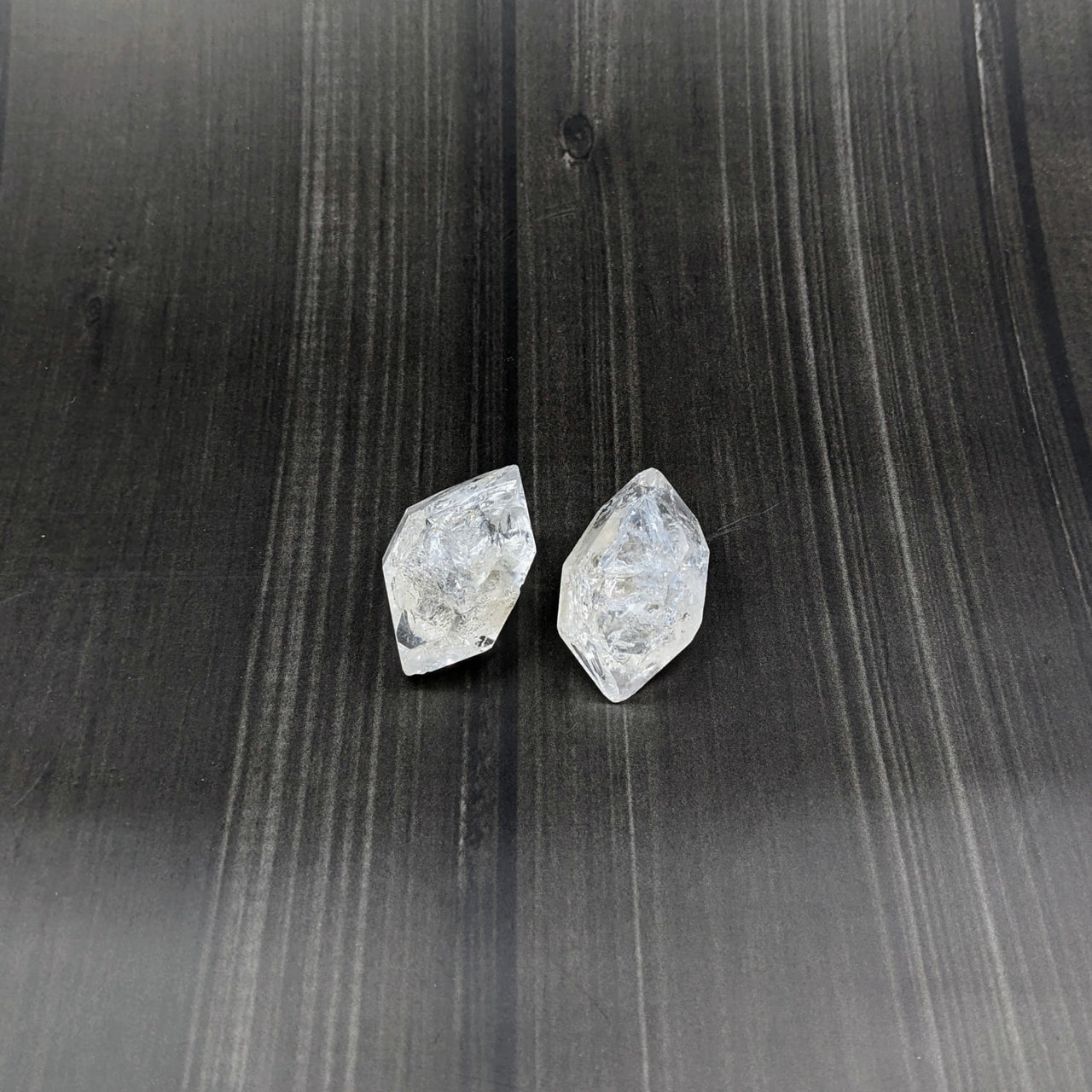 Clear quartz earrings on black background - Fenster Double Terminated Rough Point #SK7291