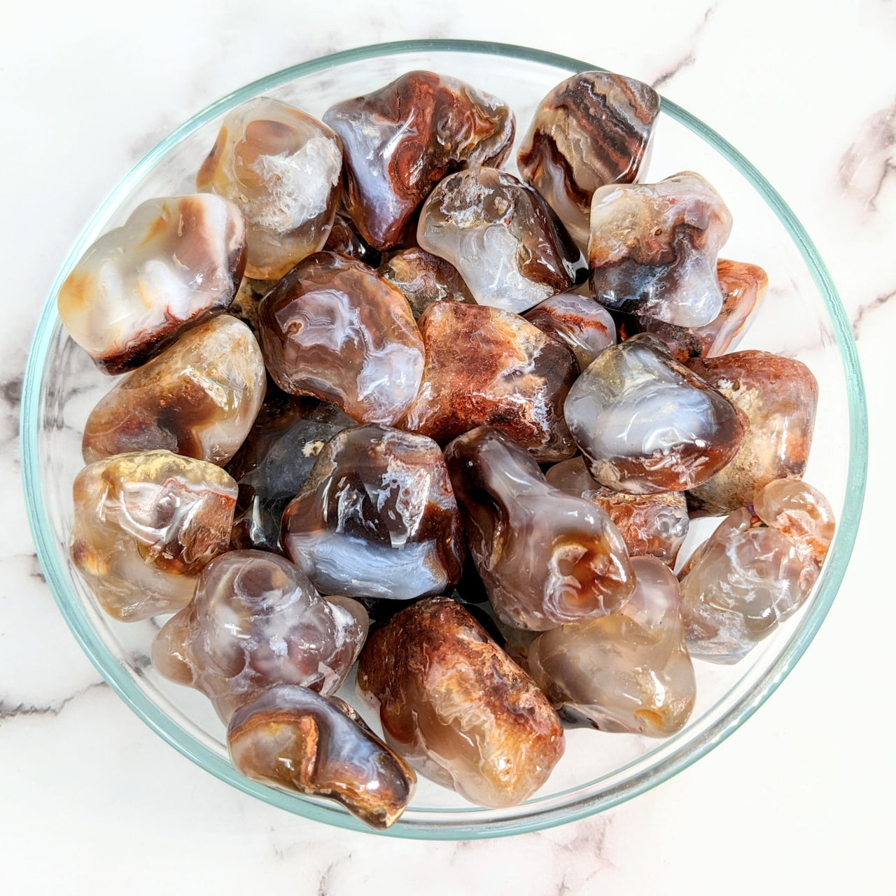 A bowl of ice and ice cubes with Fire Agate Semi-Smooth Tumbled Stones #LV1572