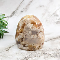 Thumbnail for Flower Agate Freeform: Large Brown and White Marble Egg on Marble Counter #LV5267