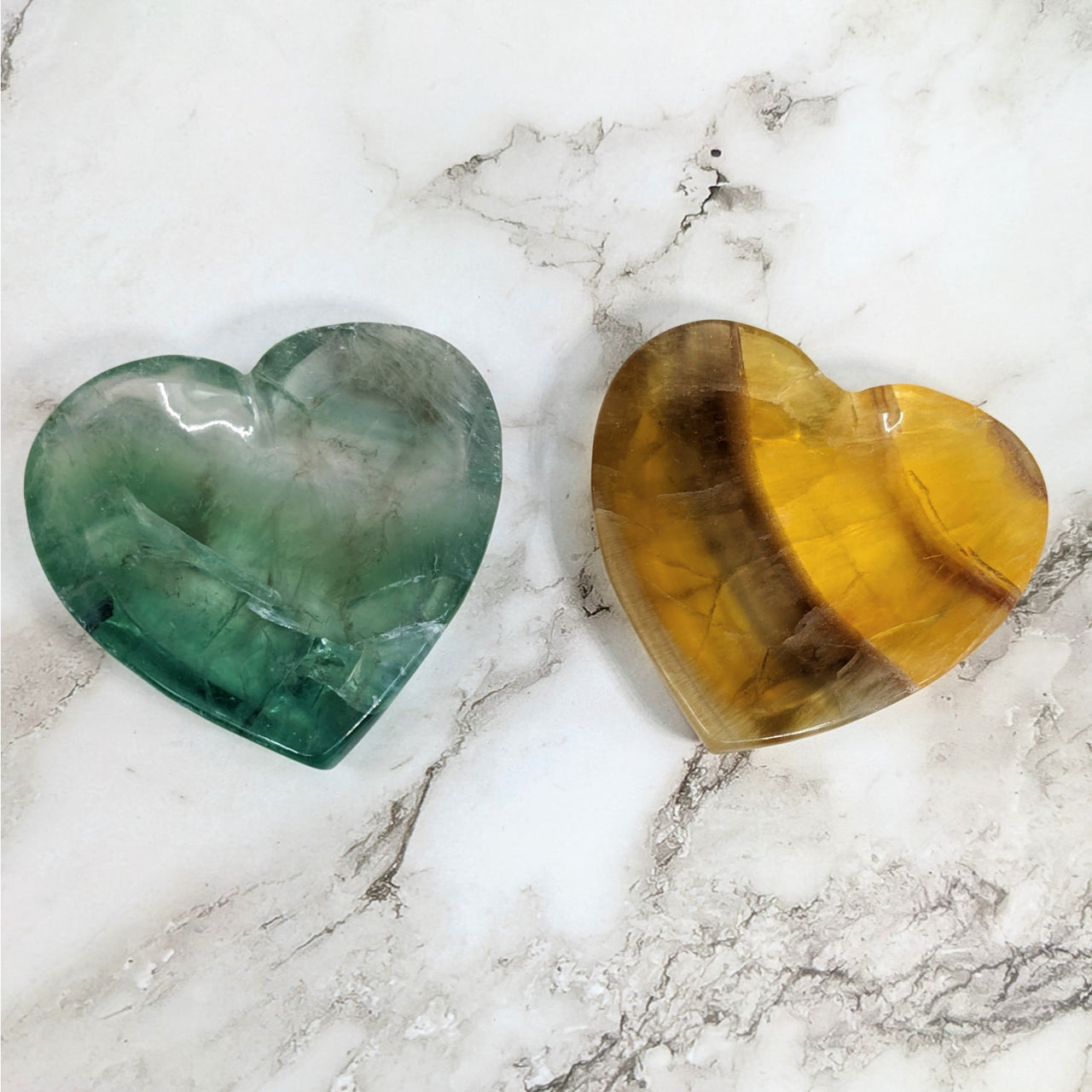 Heart-shaped fluorite gems on marble table in Fluorite Heart Bowl #LV4141