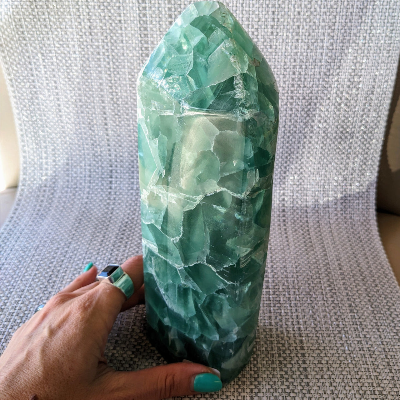 Person holding large green quartzite from Fluorite 8.5’ Freeform #LV5431 collection