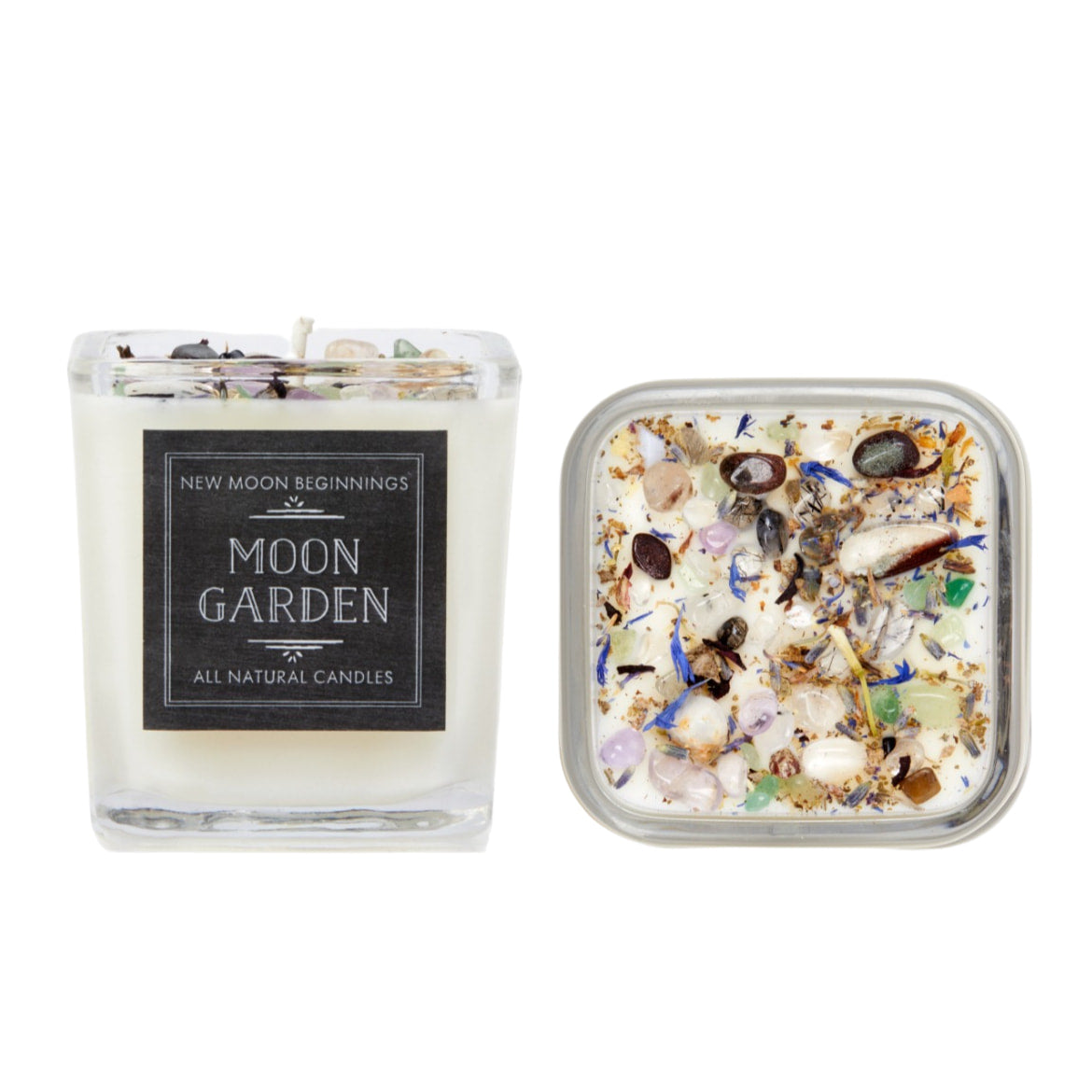 A small glass jar filled with sea shells beside crystal candles from Full Moon Candle