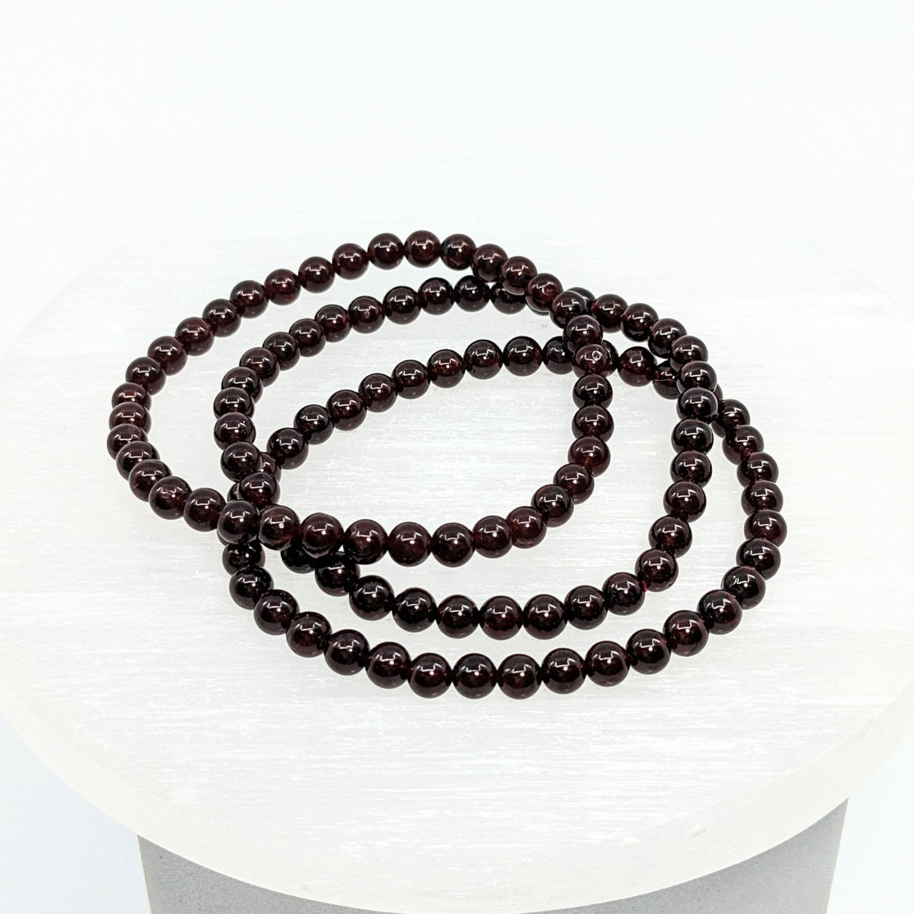 Garnet 4 mm Bracelet #LV1879 featuring a black onyxite bead