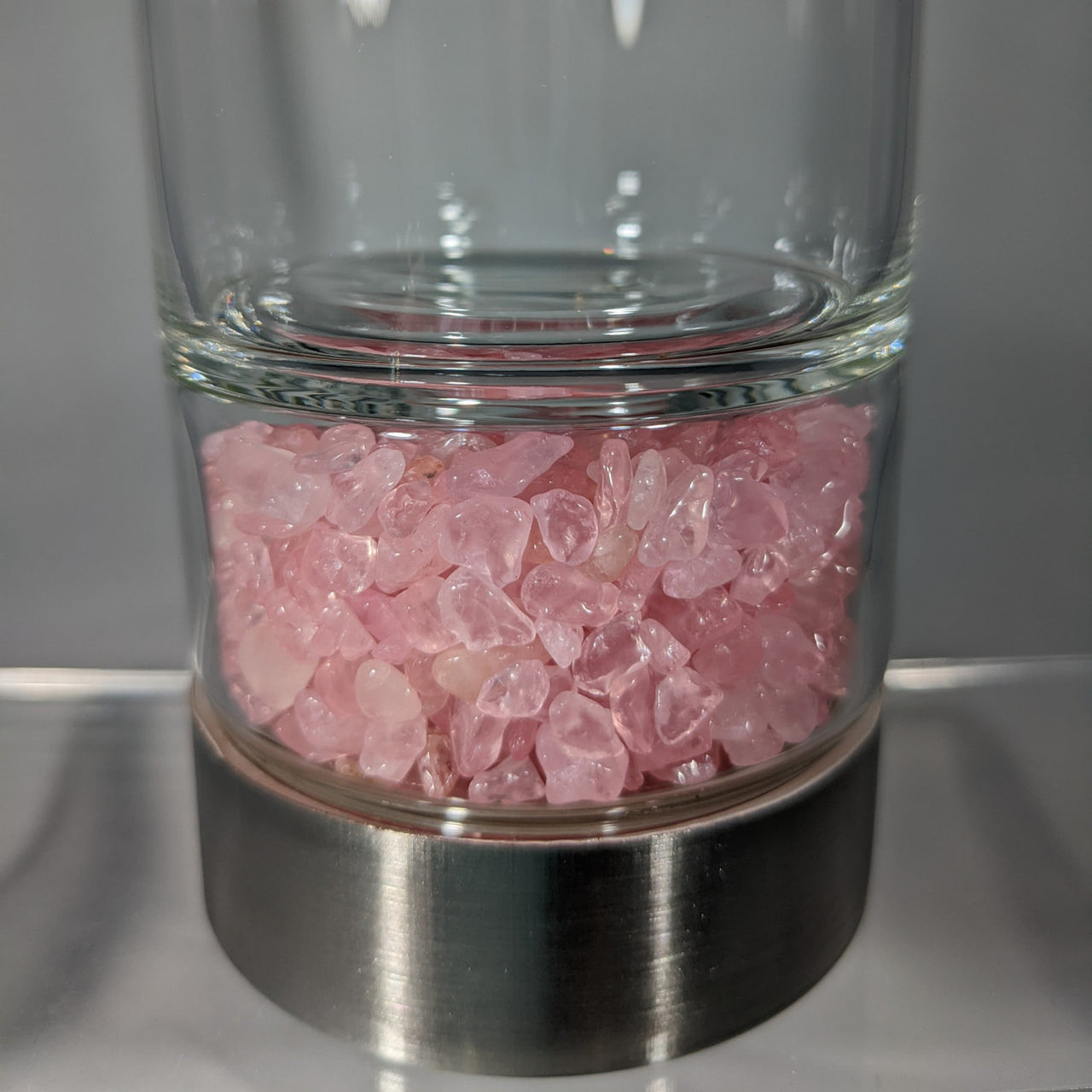 A Gem Elixir Water Bottle w/ Crystals #X003 filled with vibrant pink crystals