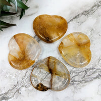 Thumbnail for Gold Hematoid quartz stones on marble surface - 1.5’ Heart Thumb Stone #LV4303