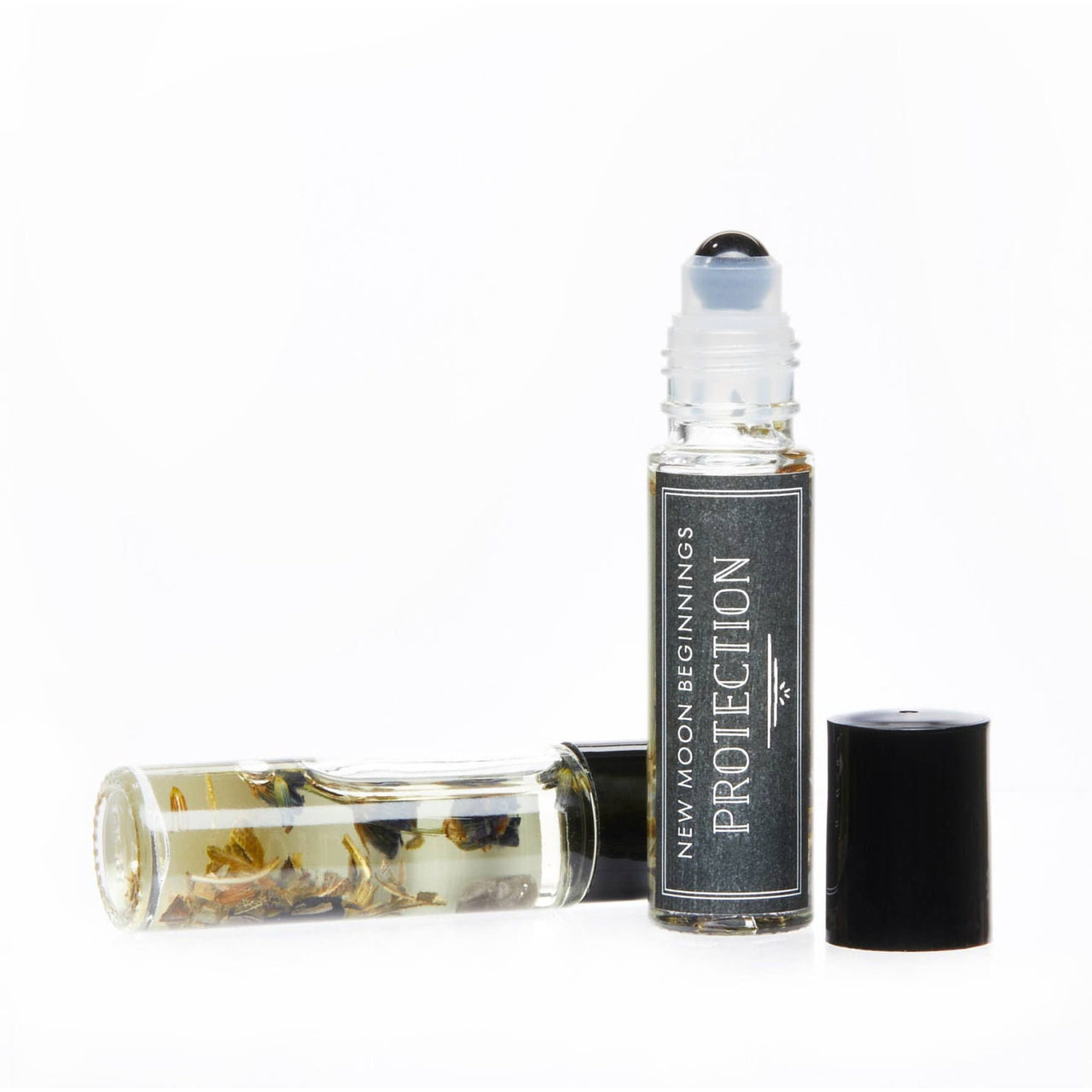 Good Luck Intention Roll on perfume with organic jojoba oil, black cap, white background