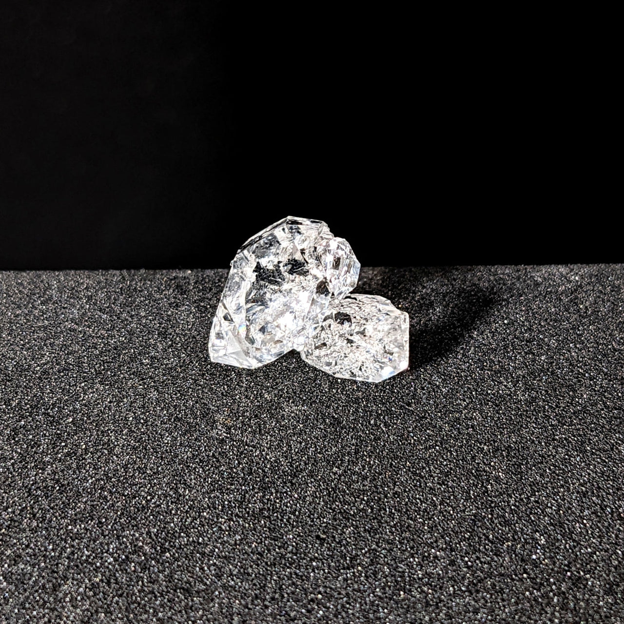 Herkimer Diamond 0.91g Point #SK9464 sparkling against a black background