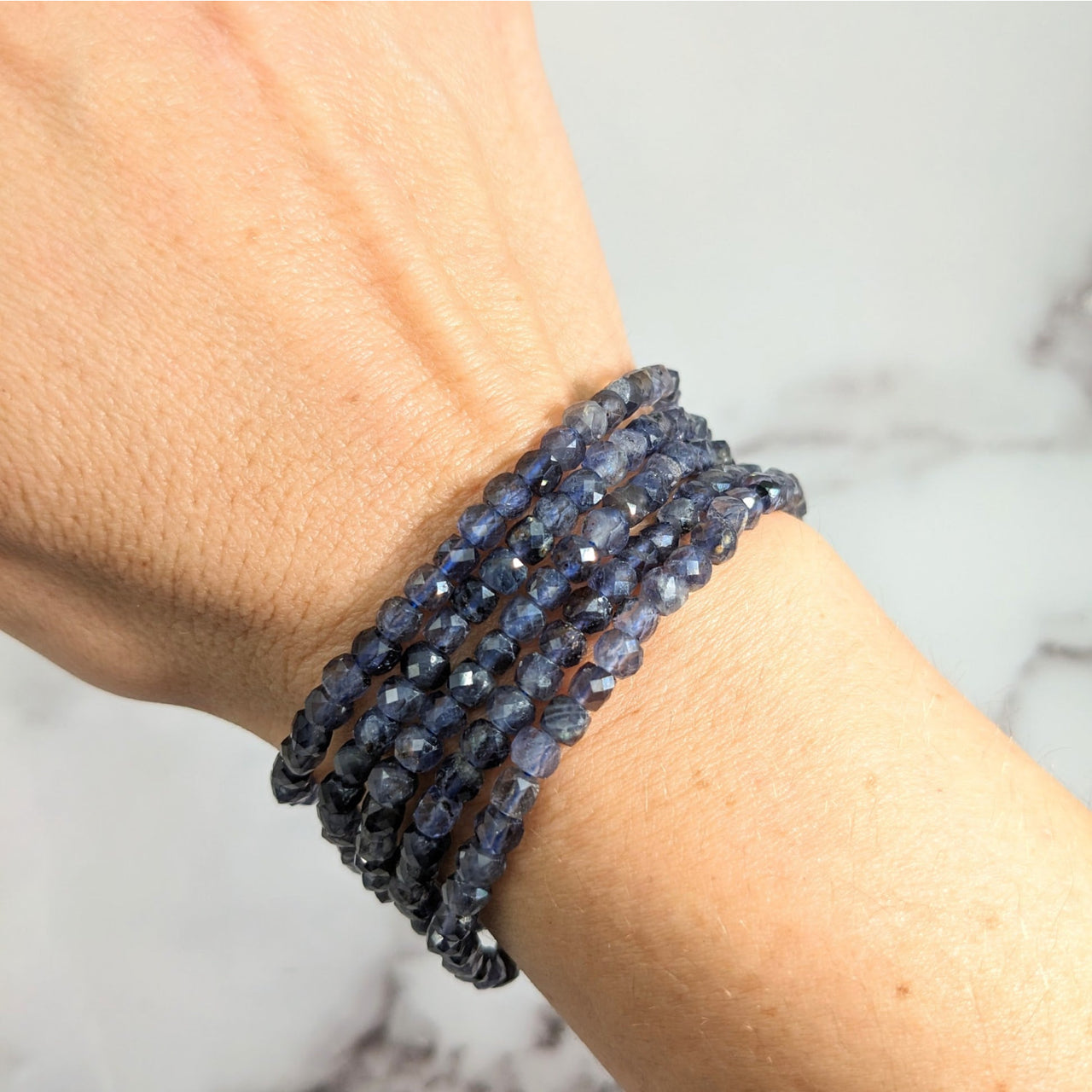 Elegant Iolite 7’ Faceted 4mm Blue Sapphire Bracelet #LV1927 in a stunning display