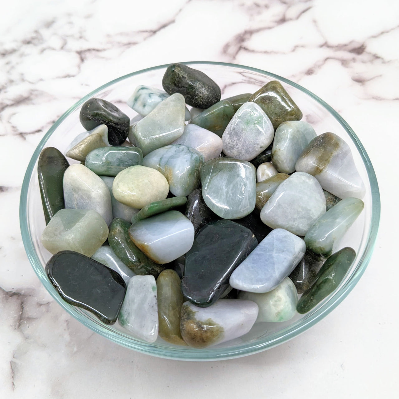 A bowl of green and white Jadeite tumbled stones #LV1477 ranging from .80 to 1.5 inches